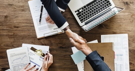 Business people shaking hands together Business people shaking hands together